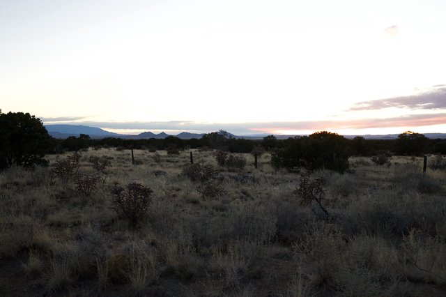 Desert Twilight Over Distant Mountain Peaks