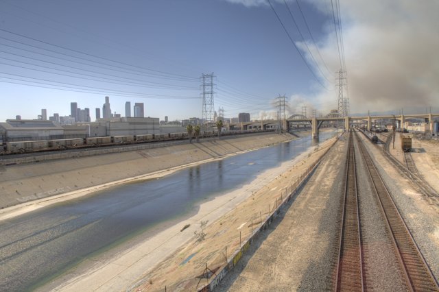 Train Tracks Against City Skyline