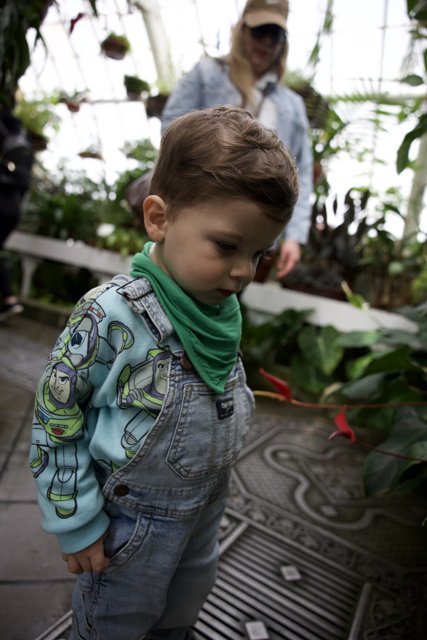 Childhood Wonder in Greenhouse Splendor
