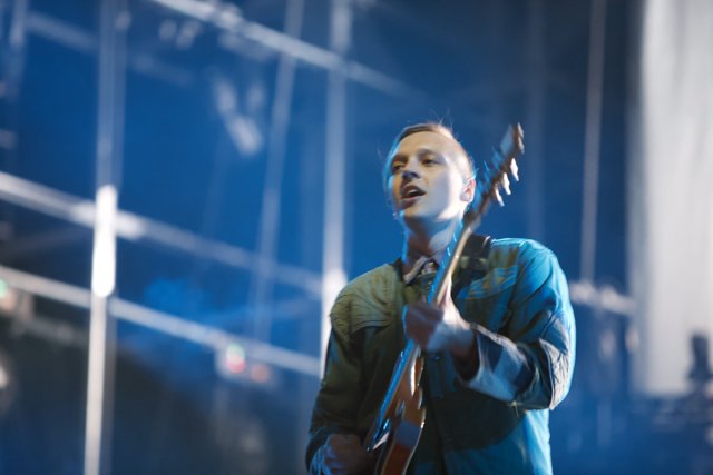 Win Butler Rocks the Stage with his Electric Guitar