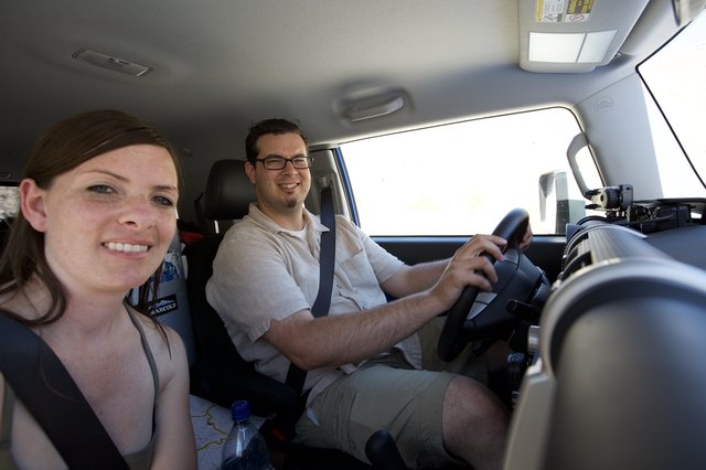 Road Trip Couple Smiling During Desert Drive