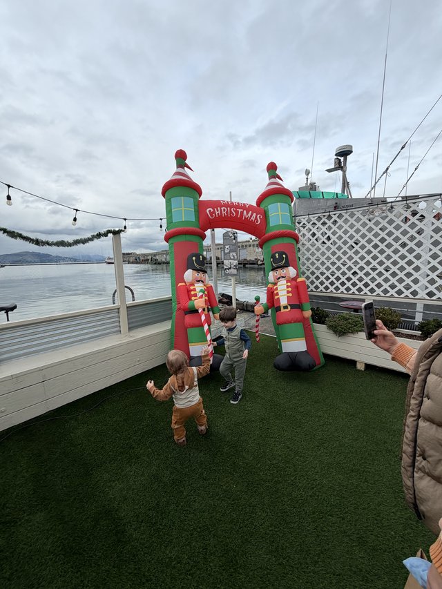 Children Playing at Waterfront Christmas Display