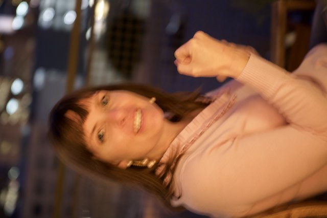 Joyful Woman Smiling at Night Cityscape