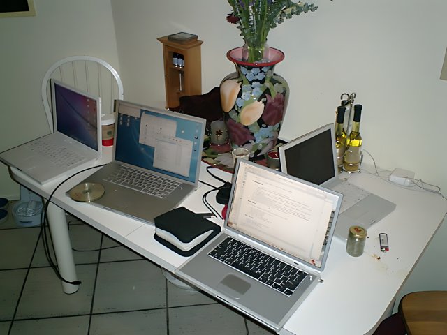The Apple Laptops on the White Table