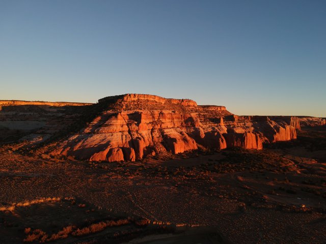 Sun sets over red rock formations