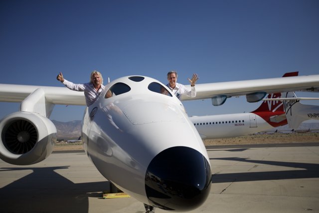 Famous Aviation Innovators Stand Proudly on Nose of White Knight Two