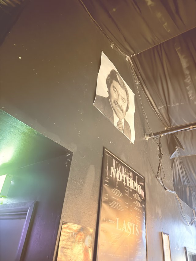 Industrial Nightclub Interior with Portrait and Poster