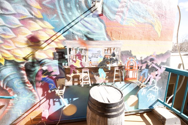 Vibrant Mural Reflections in Santa Fe Gallery Window