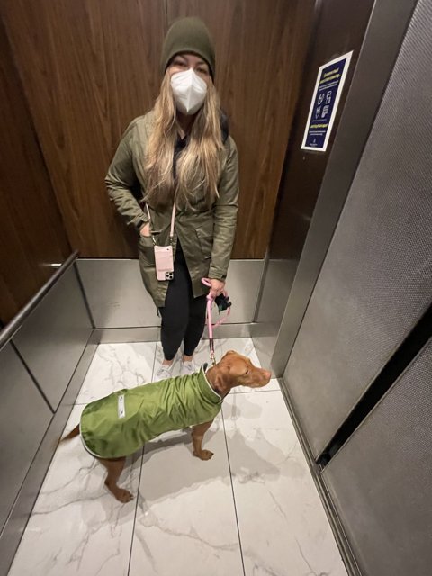 Woman and Dog in Elevator