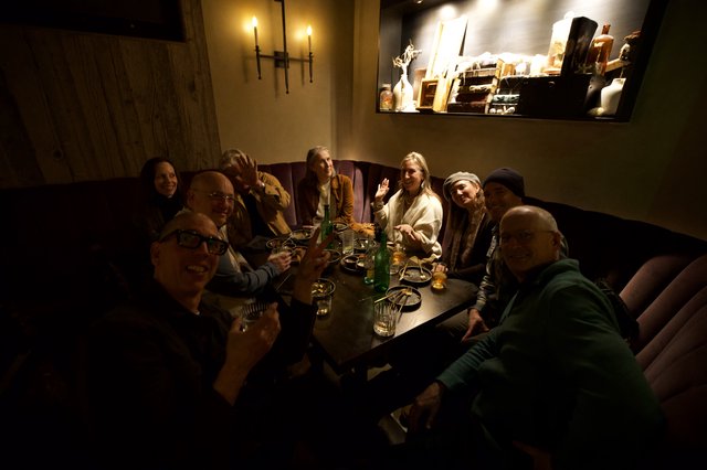 Friends Gathered for Intimate Cocktail Hour in Cozy Lounge