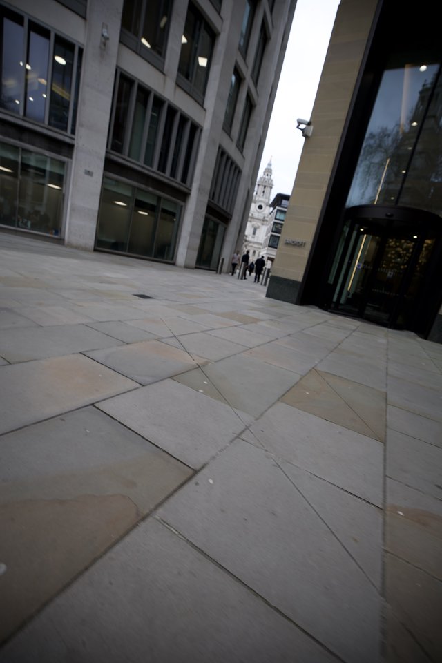 Modern Urban Plaza Leading to Historic Church Tower