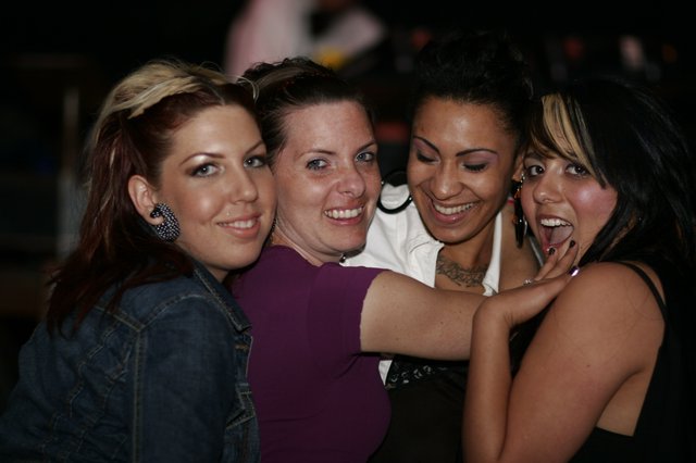 Four Friends Celebrating at a Nightclub in 2006