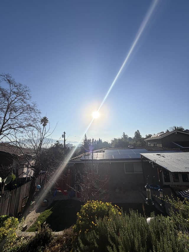 Suburban Home with Solar Panels at Golden Hour