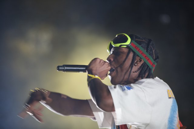 Entertainer with a Microphone and Green Headband