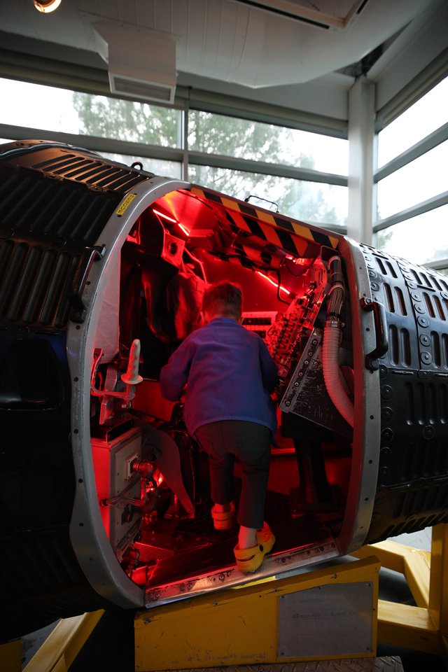 Inside the Red-Lit Interior of Historic Aircraft Fuselage