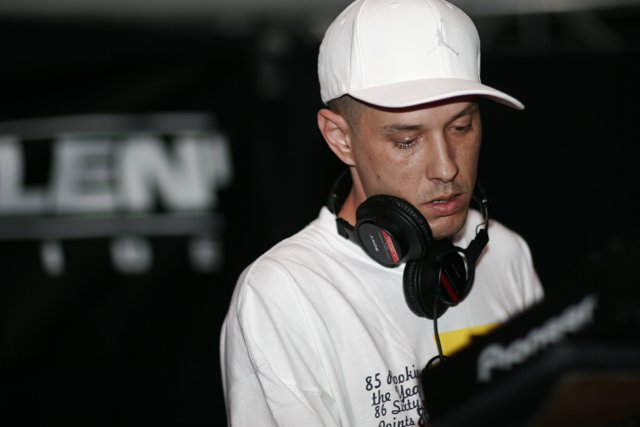 DJ S in his Classic White Cap and Headphones