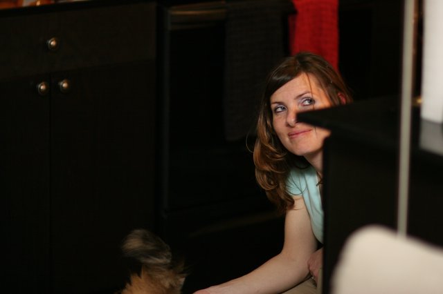 Curious Glance Behind Dark Furniture at Home