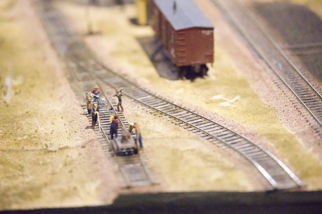 Miniature Railway Workers on Model Train Track Diorama