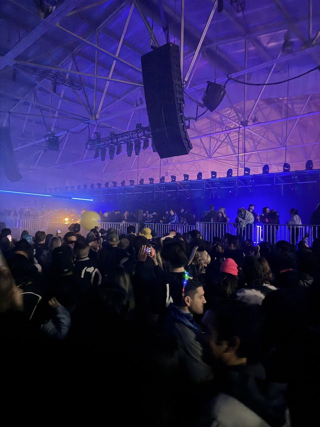 Electronic Music Event with Purple Stage Lighting
