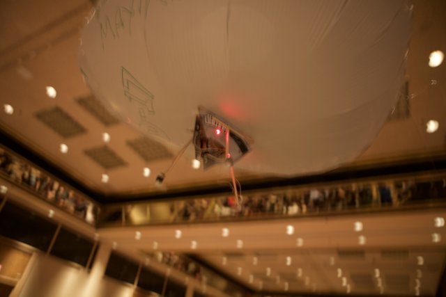 Illuminated Balloon in Indoor Auditorium
