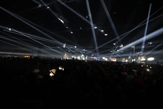 Laser Light Storm Over Massive Festival Crowd