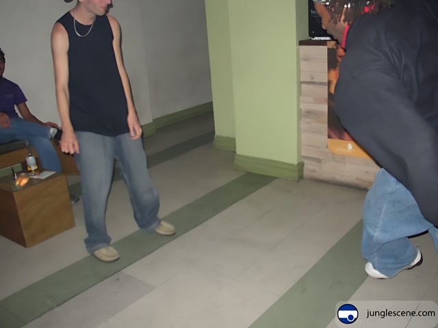 Black-Shirted Man Walking Barefoot on Plywood Flooring