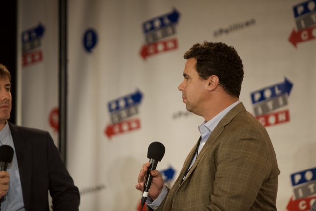Two Men Engage in Political Discourse at Politicon