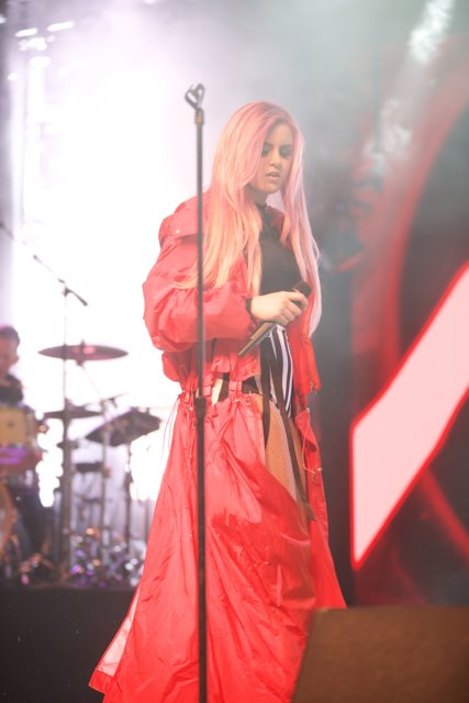 Red-Coated Singer on the Coachella Stage