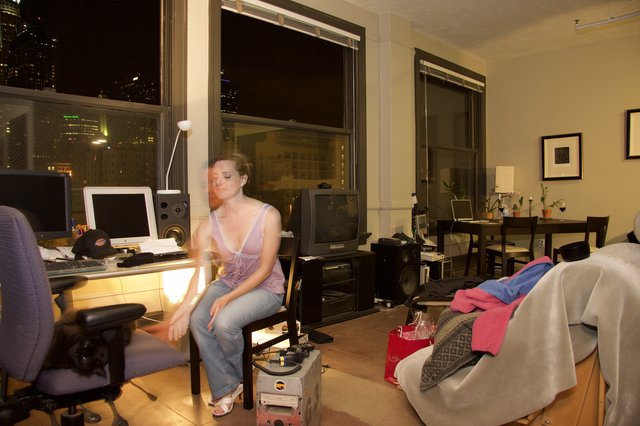 Night Owl: Woman Relaxing in Urban Loft Apartment
