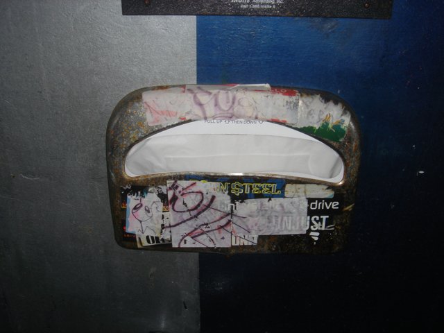 Graffiti on Toilet Paper Dispenser