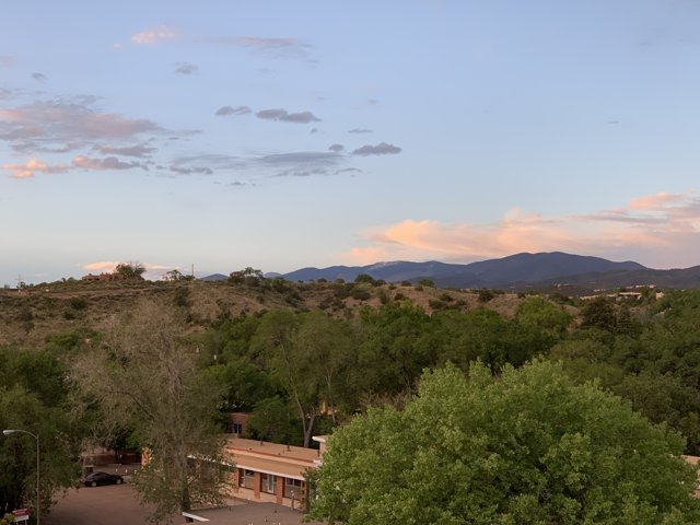 Rooftop View of Mountains and Trees