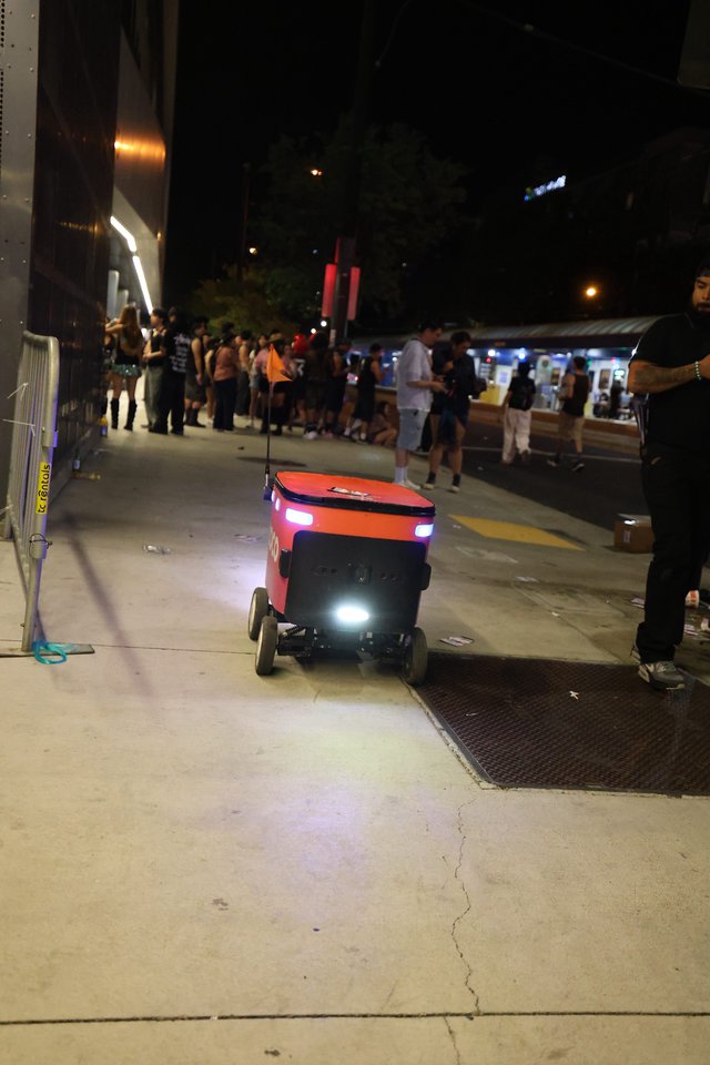 Autonomous Delivery Robot Navigates Nighttime Festival Crowd
