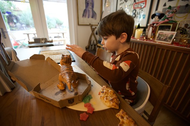 Child's Wonder at Christmas Pizza Dinosaur Meal