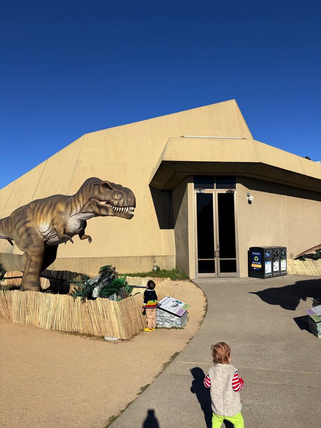 Children Observe Life-Size T-Rex at Natural History Museum