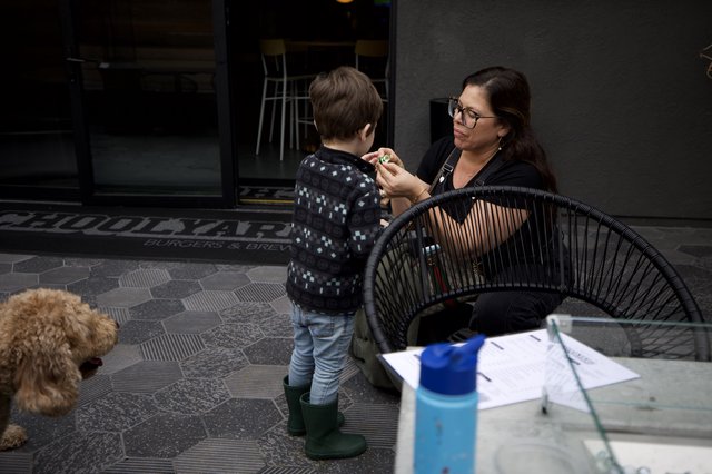 Mother and Child Moment at Outdoor Cafe