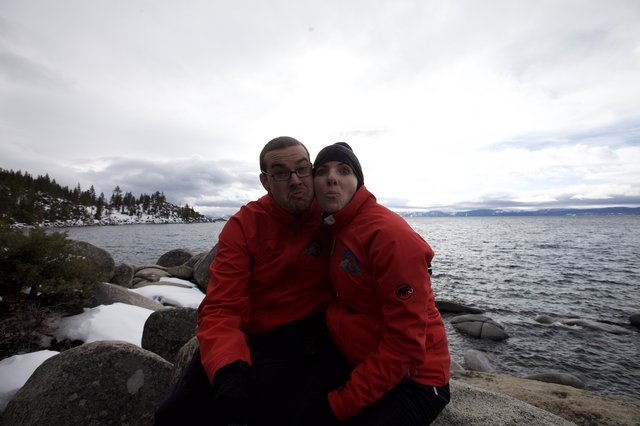 Playful Couple Posing at Snowy Lake Tahoe Shore