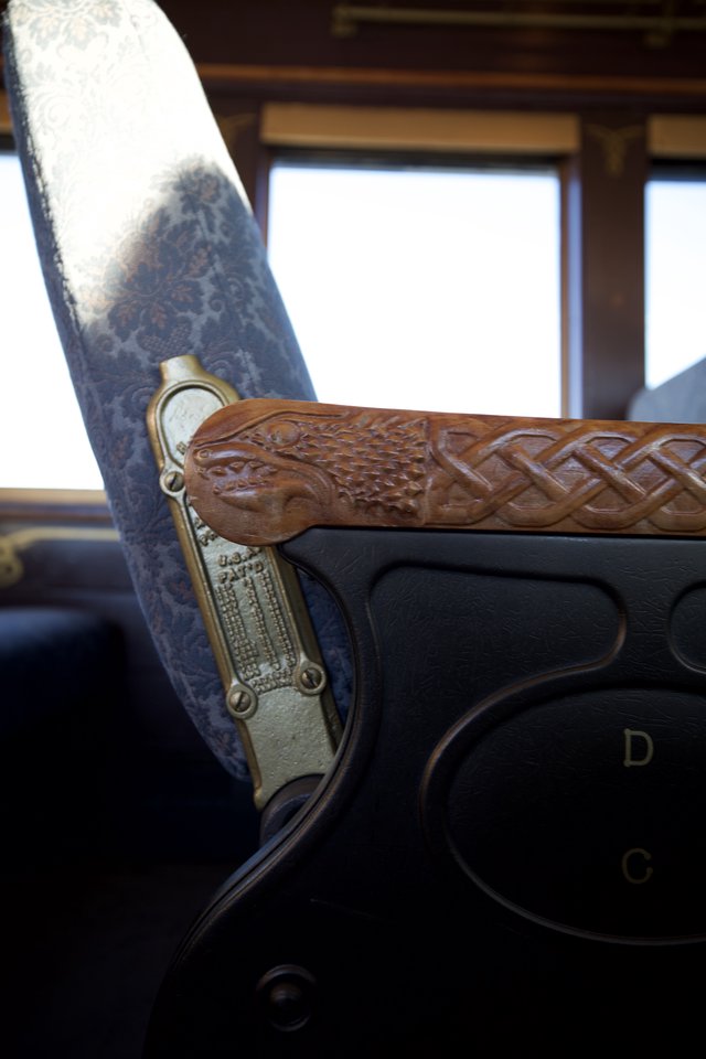 Ornate Dragon-Carved Rifle in Historic Train Car
