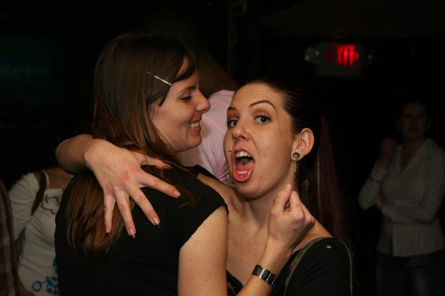Two Friends Celebrating at a Nightclub in 2005