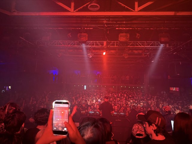 Electric Red Concert Atmosphere with Massive Crowd