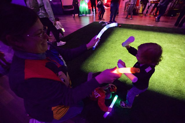 Children Playing with Glowing Toys at Baby Rave