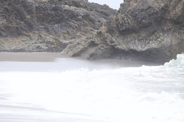 Crashing Surf Against Rugged Coastal Cliffs