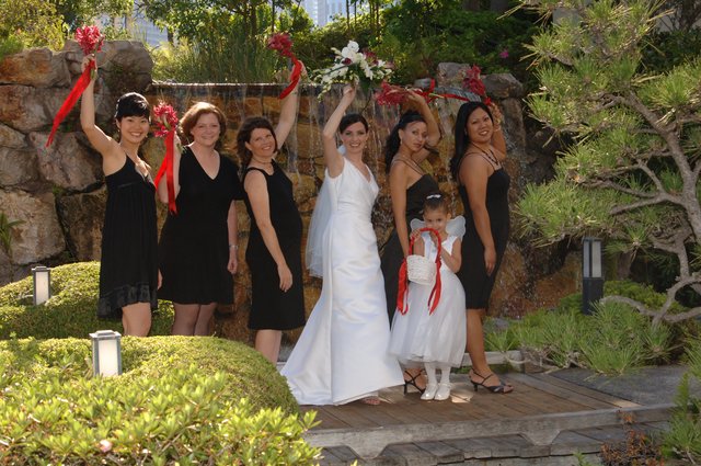Joyful Bridal Party Celebrates at Garden Waterfall
