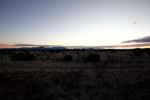 Desert Twilight Over Distant Mountain Ranges