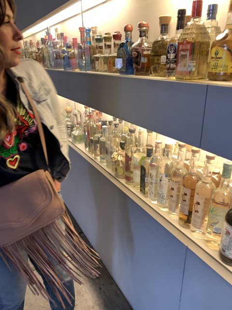 A Woman and her Liquor Shelf