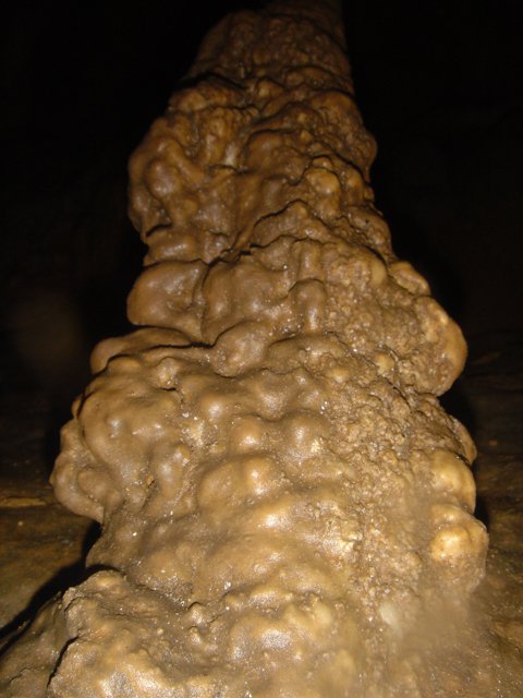 Dirt-Ridden Rock in a Natural Cave