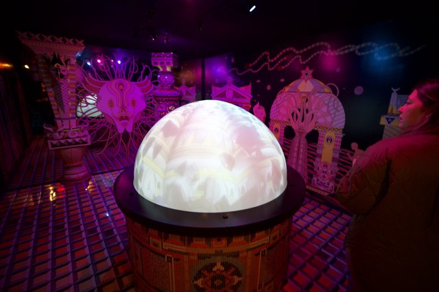 Illuminated Crystal Ball Display in Vibrant Art Installation