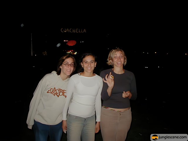 Three Women Pose in Front of Camalea Sign at Coachella 2002