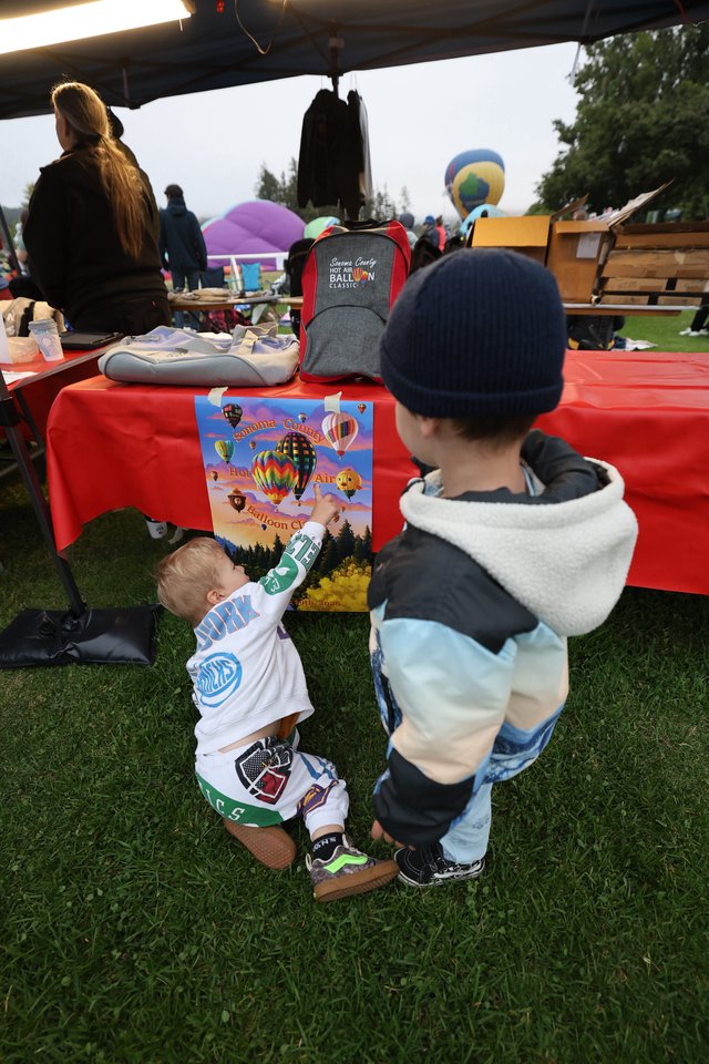 Curious Toddlers Discover Balloon Festival Poster