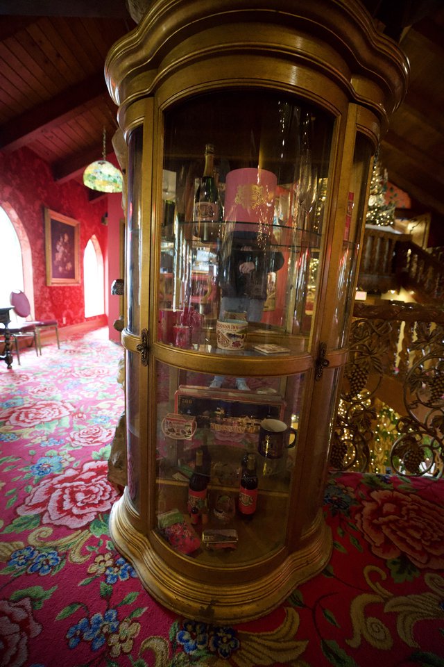Ornate Display Cabinet in Victorian-Style Parlor