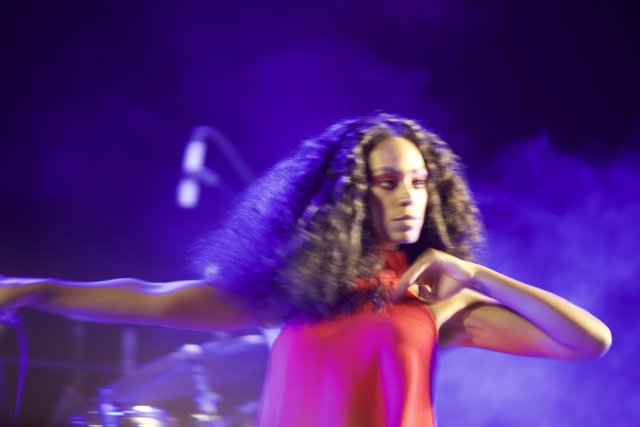 Solange Takes the Stage in a Red Dress